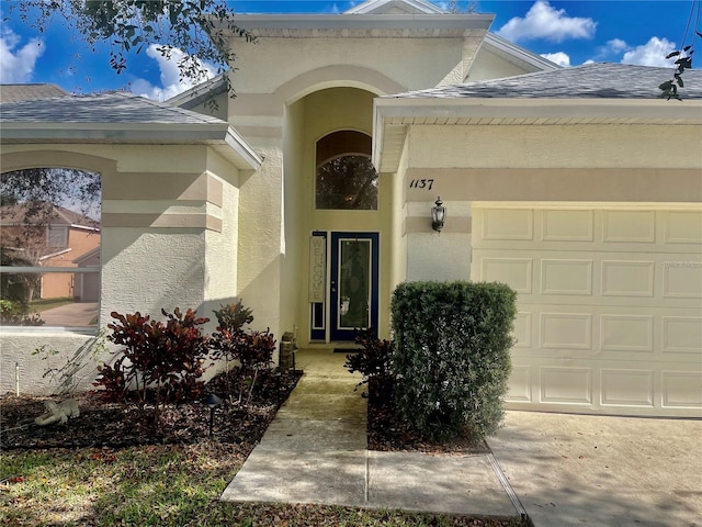 view of exterior entry featuring a garage