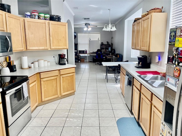 kitchen with light tile patterned flooring, appliances with stainless steel finishes, pendant lighting, and light brown cabinets