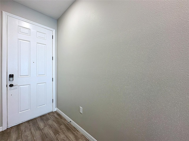 doorway featuring dark hardwood / wood-style flooring