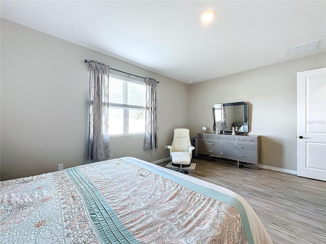 bedroom with light wood-type flooring