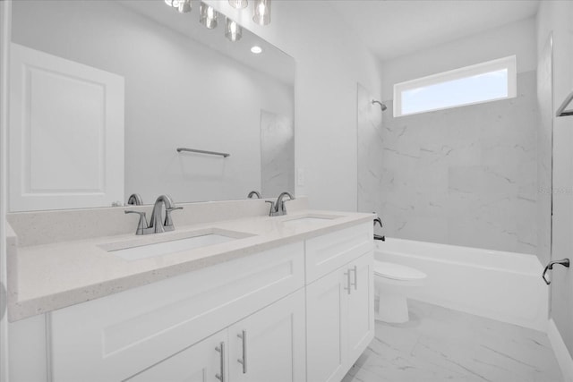 full bathroom featuring tiled shower / bath, vanity, and toilet