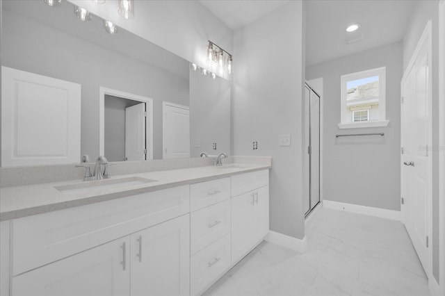 bathroom featuring vanity and walk in shower