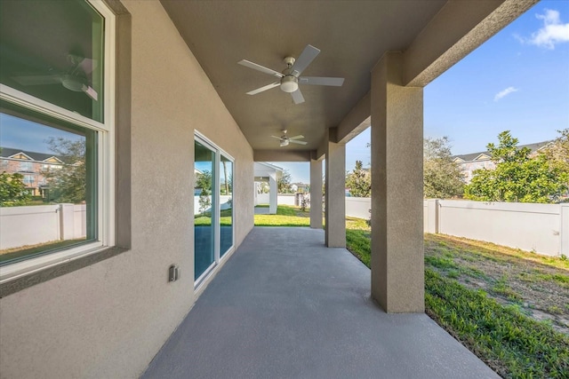 view of patio featuring ceiling fan