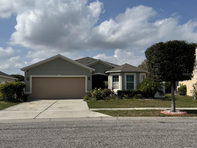 ranch-style house featuring a garage