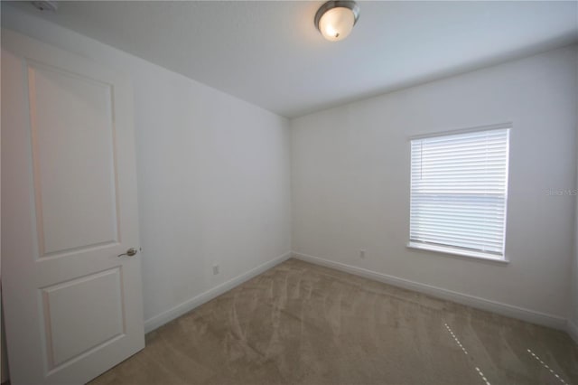 spare room featuring carpet floors