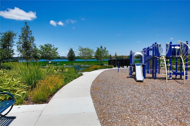 view of jungle gym with a water view