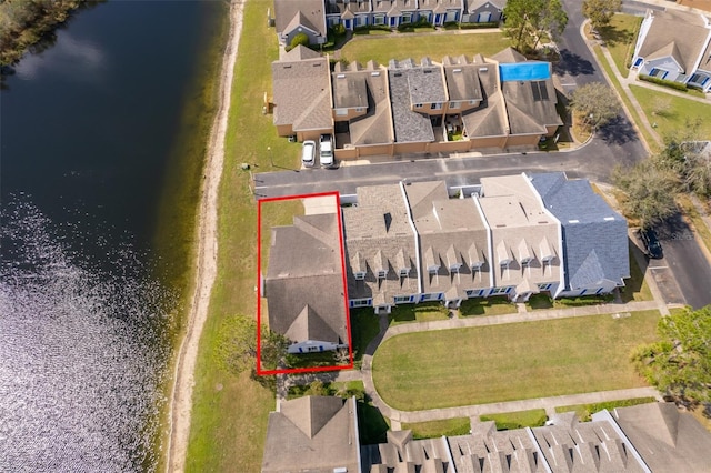 birds eye view of property featuring a water view