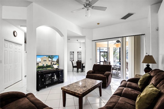 living room with ceiling fan and light tile patterned floors