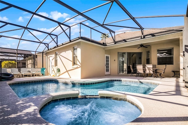 view of swimming pool featuring an in ground hot tub, a patio, a lanai, and an outdoor living space