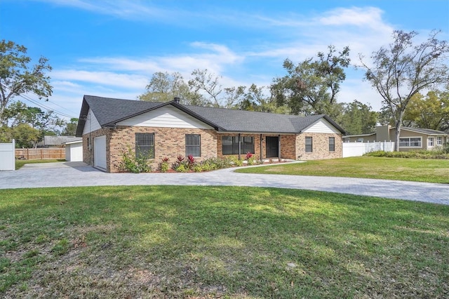 single story home with a garage and a front lawn