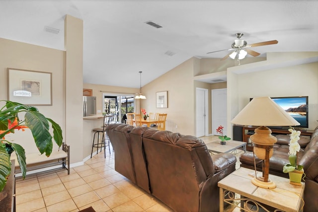 tiled living room featuring vaulted ceiling and ceiling fan