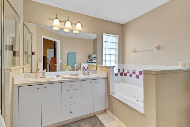 bathroom with tile patterned floors, vanity, and separate shower and tub