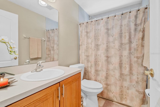 bathroom with vanity, a shower with curtain, and toilet