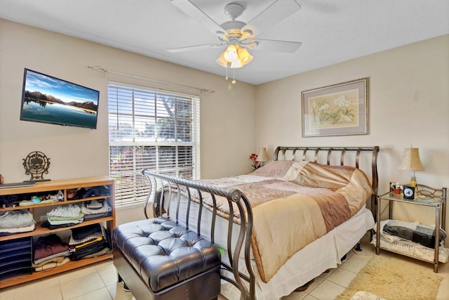 bedroom featuring ceiling fan and light tile patterned floors