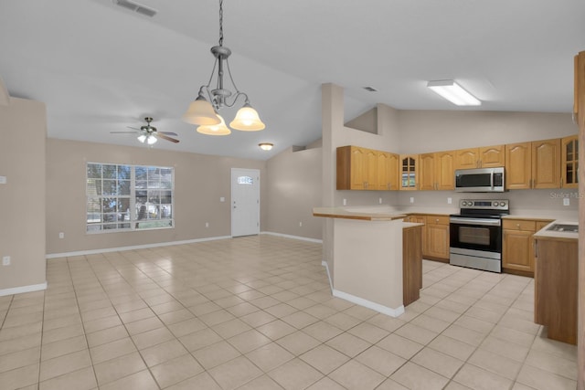 kitchen with glass insert cabinets, stainless steel appliances, light countertops, visible vents, and lofted ceiling