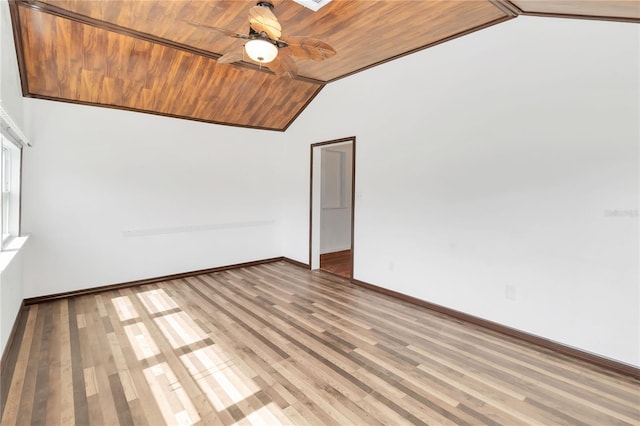 empty room with wood ceiling, ceiling fan, vaulted ceiling, and hardwood / wood-style floors