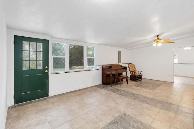 entrance foyer featuring ceiling fan