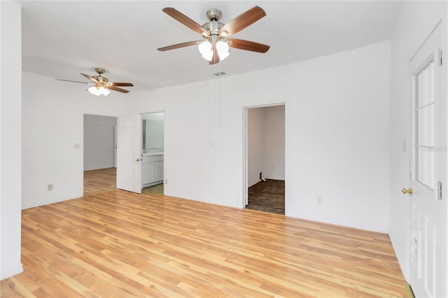 spare room featuring light wood-type flooring