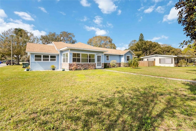 ranch-style house with a front yard