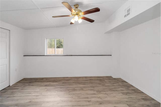 spare room featuring ceiling fan and light hardwood / wood-style flooring