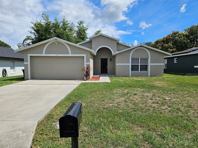 ranch-style house featuring a garage and a front yard