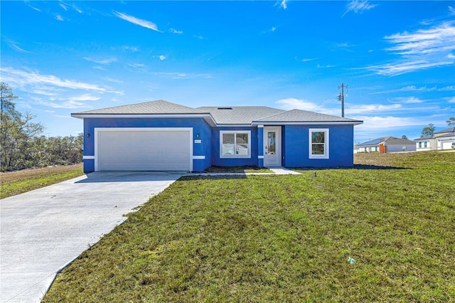 ranch-style home featuring a garage and a front yard