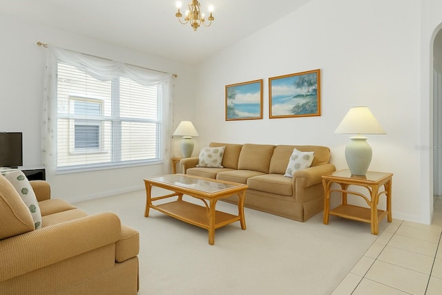 8595 Sunrise Key Dr, Kissimmee, FL 34747 - living room with a chandelier, baseboards, and arched walkways