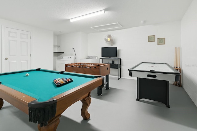 8595 Sunrise Key Dr, Kissimmee, FL 34747 - rec room featuring washing machine and dryer, concrete floors, concrete block wall, billiards, and a textured ceiling