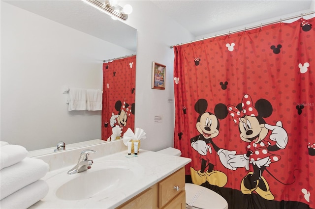 8595 Sunrise Key Dr, Kissimmee, FL 34747 - bathroom with toilet, curtained shower, and vanity