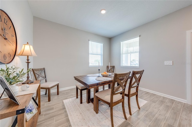 dining room featuring wood finish floors and baseboards