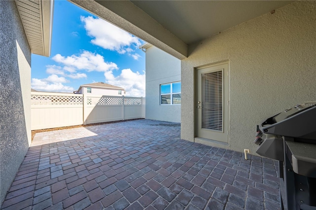 view of patio / terrace featuring fence