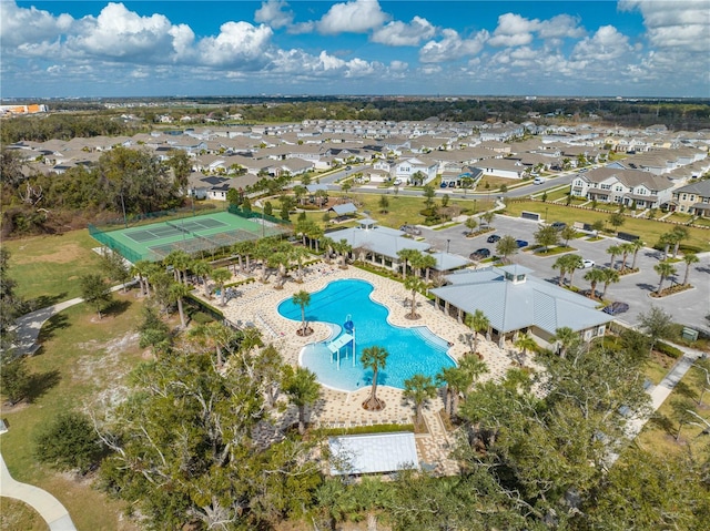 birds eye view of property with a residential view