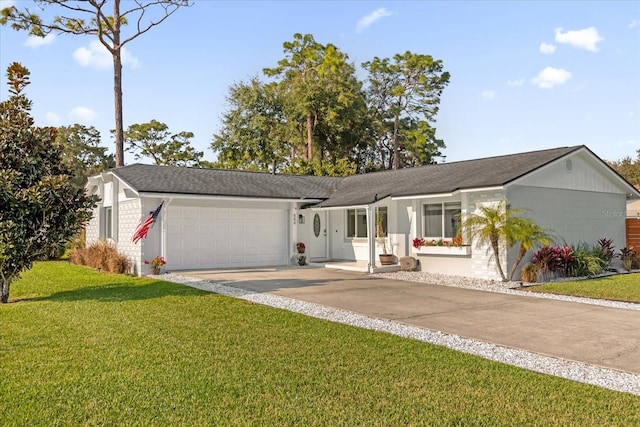 single story home with a garage and a front lawn