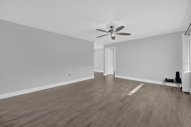 unfurnished living room featuring hardwood / wood-style floors and ceiling fan