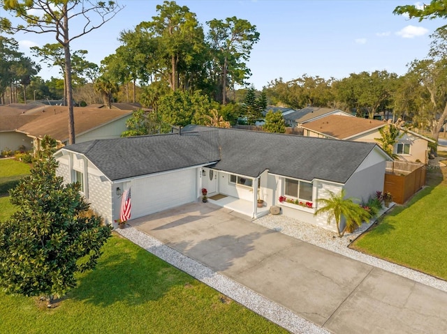 view of front of home featuring a garage and a front lawn