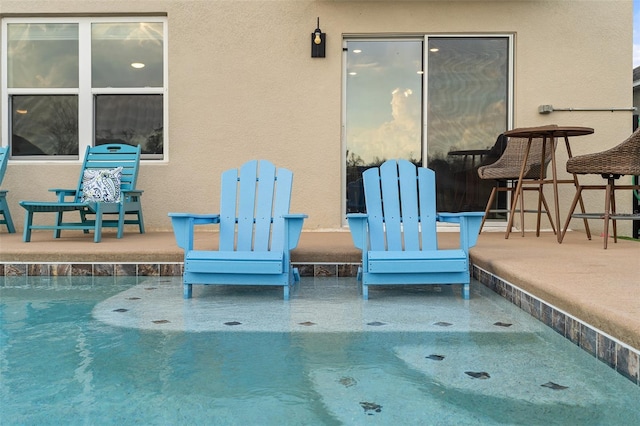 view of patio / terrace featuring a swimming pool