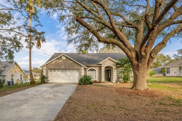 ranch-style home with a garage and a front yard