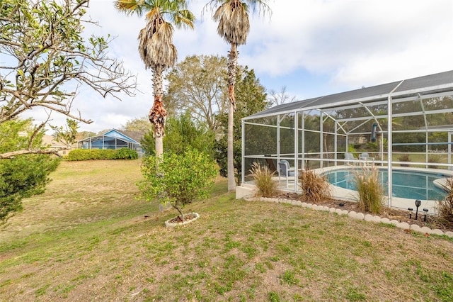 view of yard with a lanai