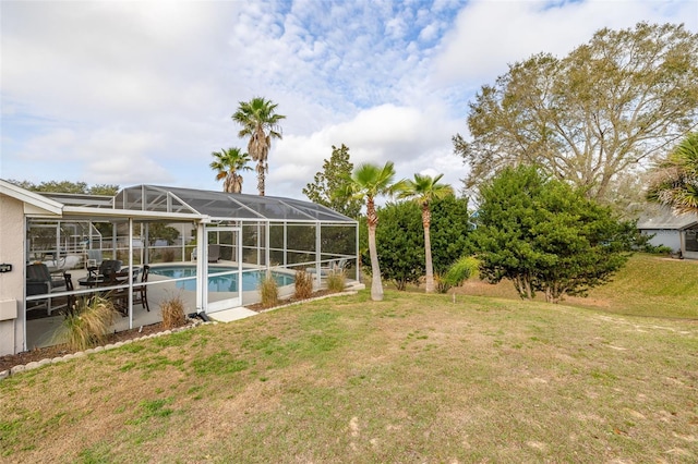 view of yard with glass enclosure