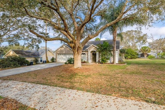 view of front of property featuring a garage and a front yard