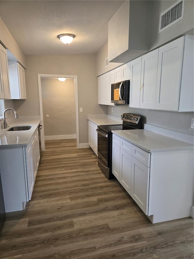 kitchen featuring white cabinetry, dark wood-type flooring, sink, and stainless steel electric stove