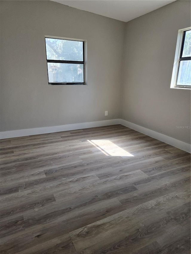 empty room featuring dark wood-type flooring