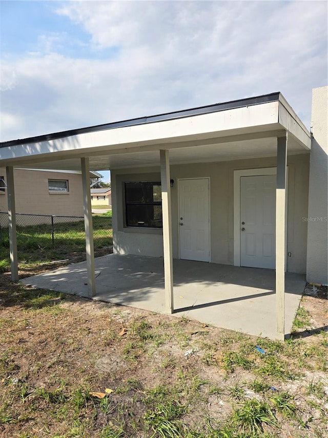 exterior space featuring a carport