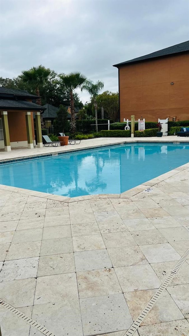 pool with a patio