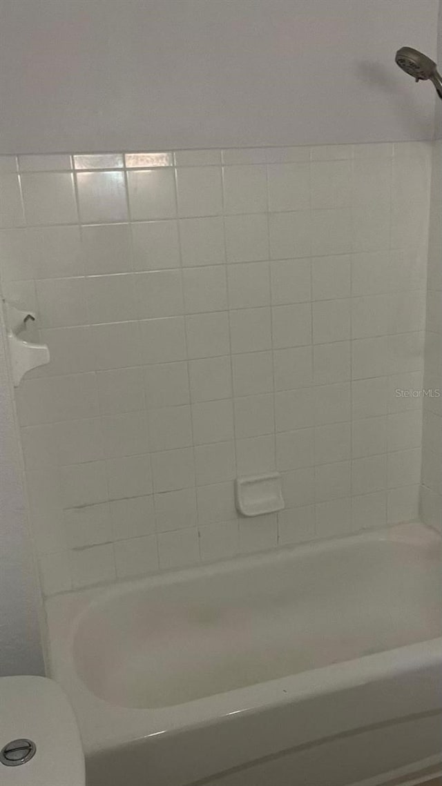 full bath featuring shower / bathing tub combination and toilet