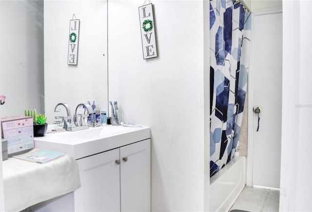 full bathroom featuring shower / bath combination with curtain and vanity