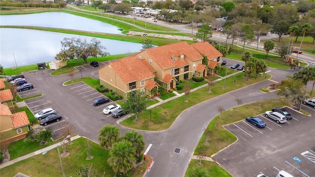 birds eye view of property featuring a water view