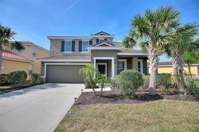 view of front of home featuring a garage and a front yard