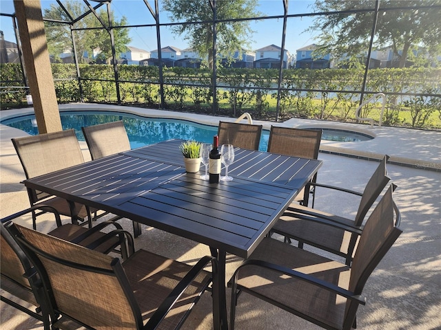 view of patio featuring a pool with hot tub