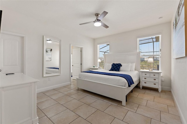 bedroom featuring light tile patterned flooring and ceiling fan